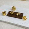 Picture of 18K gold-plated titanium huggies—florals, drops & geo studs