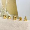 Picture of 18K gold-plated titanium huggies—florals, drops & geo studs