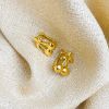 Picture of 18K gold-plated titanium huggies—florals, drops & geo studs