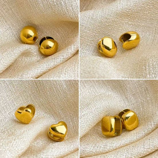 Picture of 18K gold titanium huggies—sphere, oval & heart trio