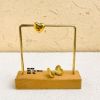 Picture of 18K gold titanium huggies—sphere, oval & heart trio