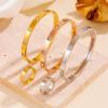 Picture of 18K gold-plated, hand-polished titanium-steel nail-bangle