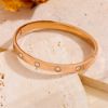 Picture of 18K gold-plated, hand-polished titanium-steel nail-bangle