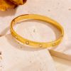 Picture of 18K gold-plated, hand-polished titanium-steel nail-bangle