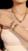 Picture of German heavy-craft matte-gold multi-layer chain necklace & bracelet set