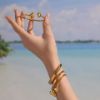 Picture of 18K gold plated triangle hollow flex Luxurious bangle