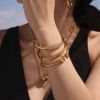 Picture of 18K gold plated triangle hollow flex Luxurious bangle